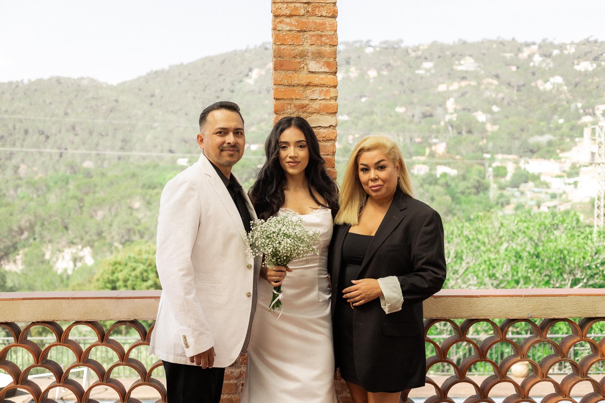 Mercedes with her family on the terrace at Can Borrell, with the hills behind