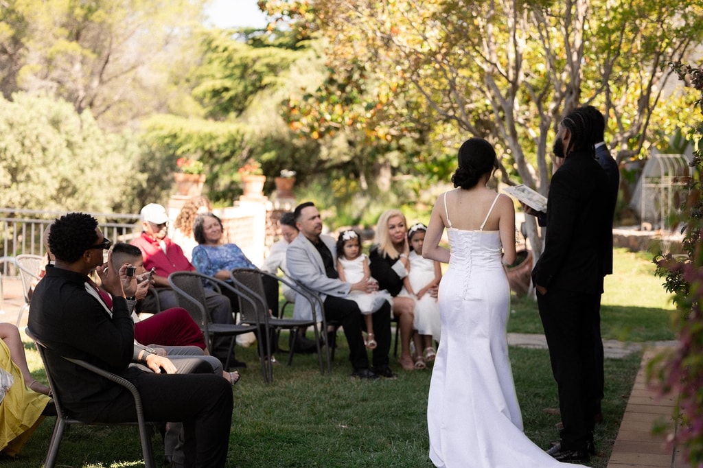 Mercedes and Jay’s ceremony on the lawn at Can Borrell, with family seated around